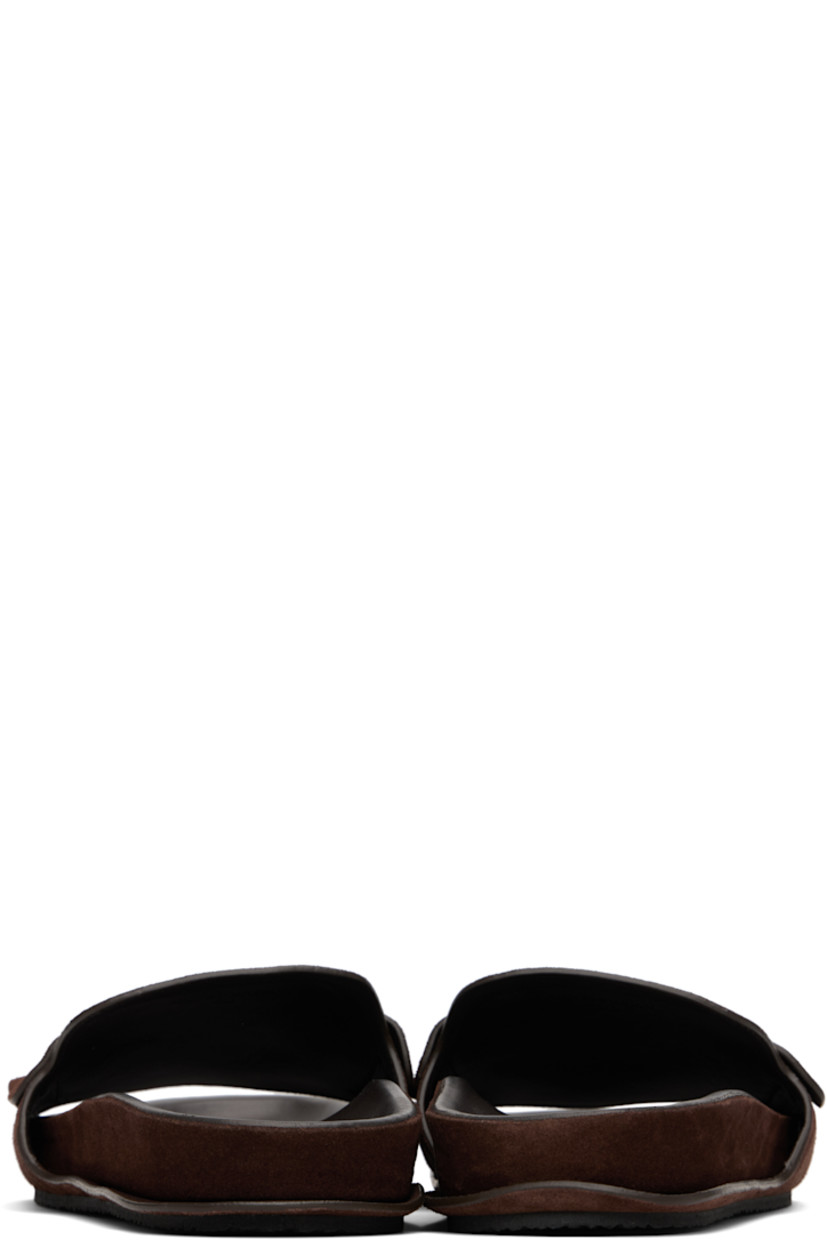 Calfskin suede flat sandals.

· Hand-stitched detailing throughout
· Open toe
· Strap with cutout at vamp
· Logo-embossed molded lambskin footbed
· Crêpe-rubber sole

Part of the La Croisière collection.

Supplier color: Dark brown