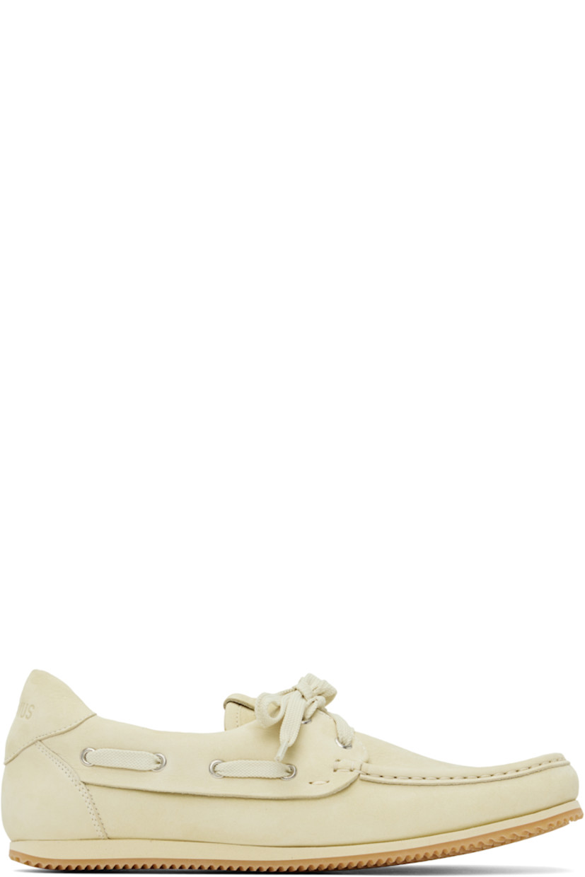 Nubuck boat shoes in beige. 

· Square moc toe 
· Lace-up closure
· Logo patch at tongue
· Lace-up detailing at padded collar
· Logo embossed at heel tab
· Buffed leather and suede lining 
· Treaded rubber sole 

Part of the La Croisière collection. 

Supplier color: Pale yellow