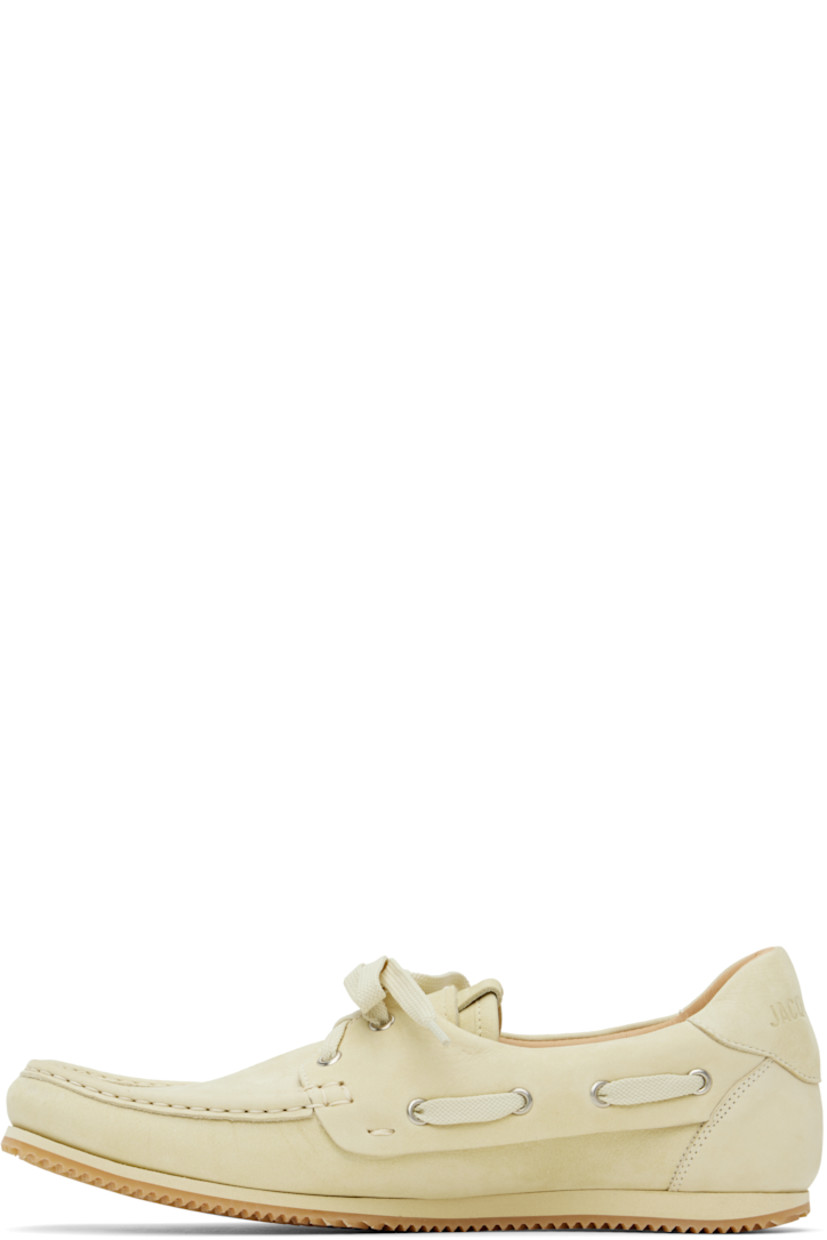 Nubuck boat shoes in beige. 

· Square moc toe 
· Lace-up closure
· Logo patch at tongue
· Lace-up detailing at padded collar
· Logo embossed at heel tab
· Buffed leather and suede lining 
· Treaded rubber sole 

Part of the La Croisière collection. 

Supplier color: Pale yellow