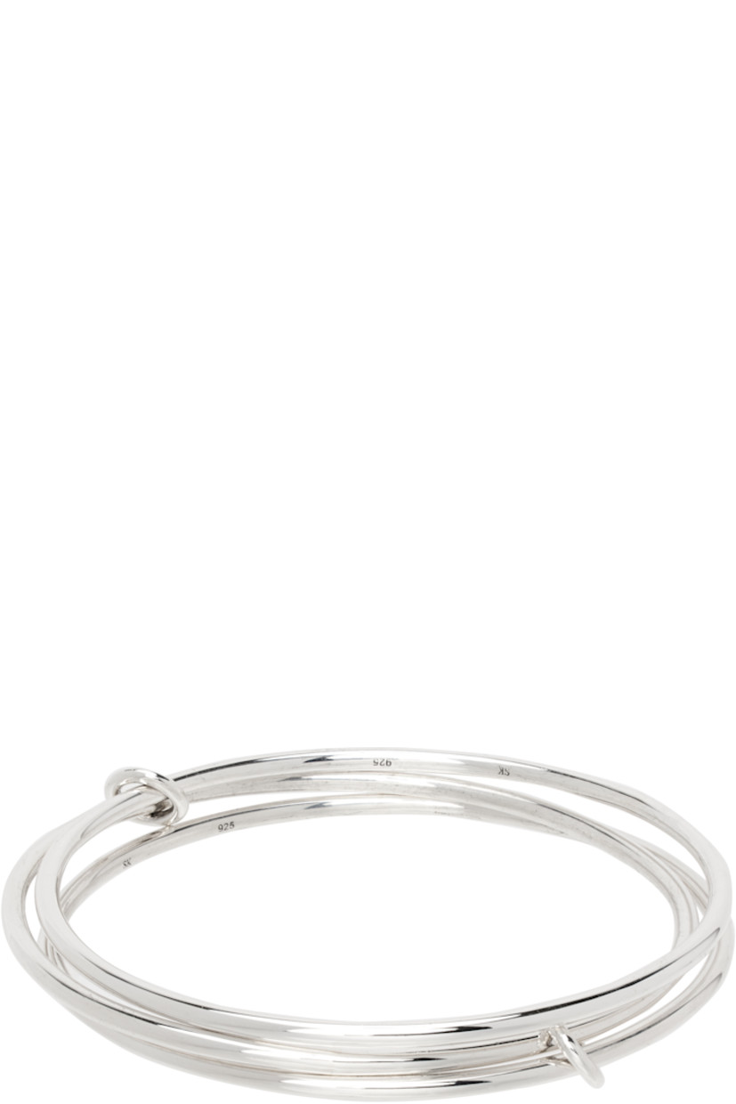 Handcrafted stacked cuff bracelet in sterling silver. 

· Sliding O-rings at length
· Logo and hallmark at inner bands

Supplier color: Sterling silver