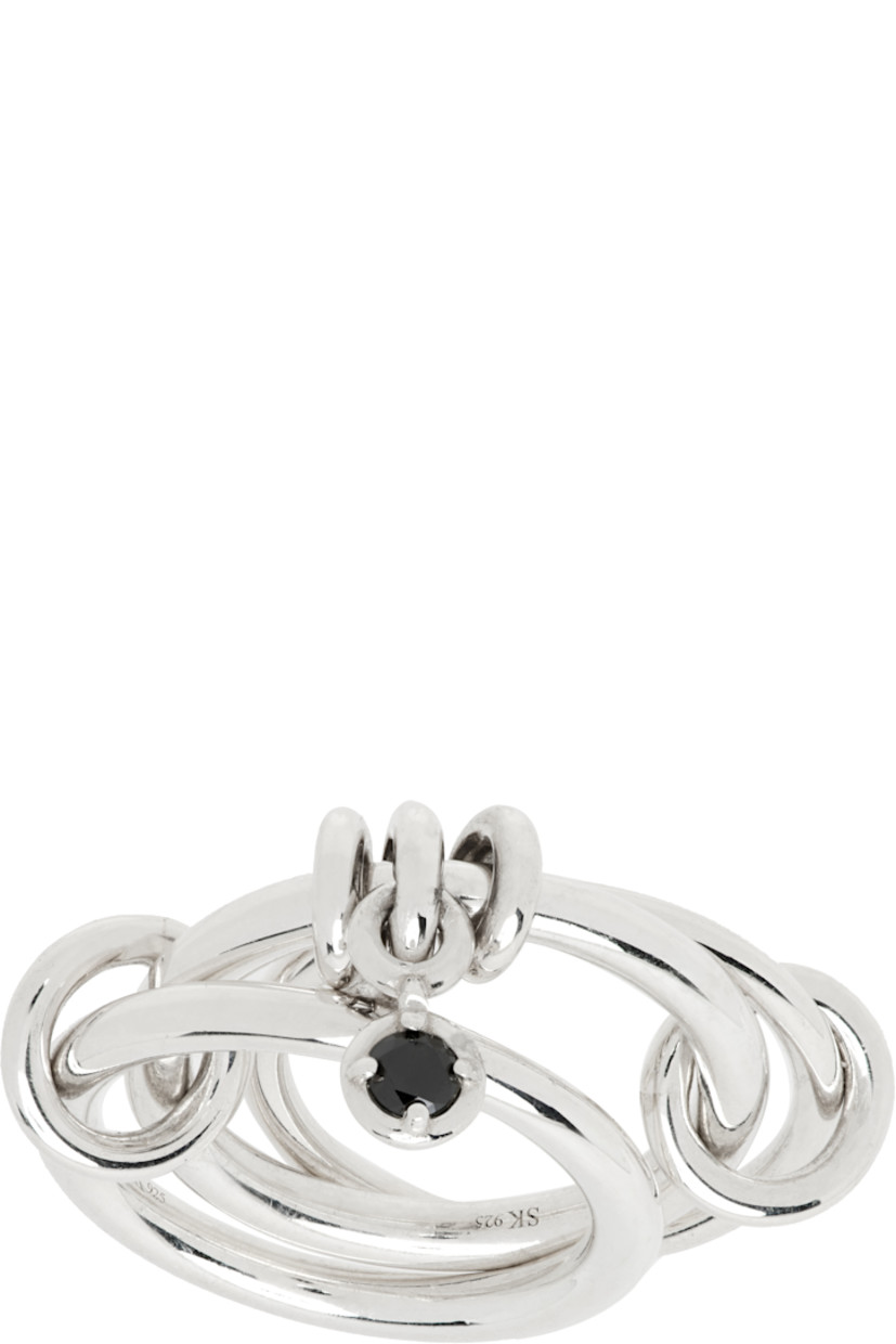 Handcrafted stacked rings in sterling silver. 

· O-rings with bezel-set 0.11 cttw black diamond
· Logo and hallmarking at inner band

Supplier color: Sterling silver