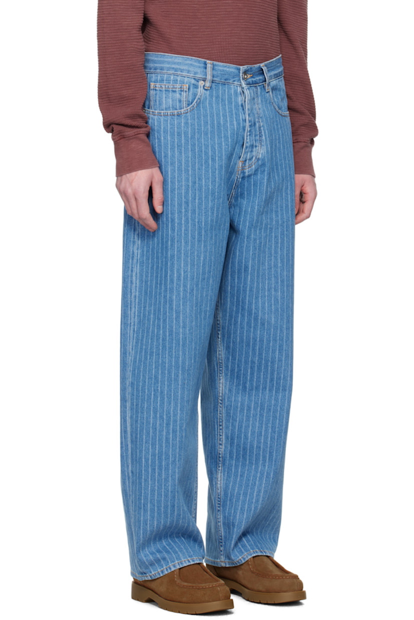 Loose-fit non-stretch denim jeans. Jacquard stripes and subtle fading throughout.

· Low-rise
· Belt loops
· Five-pocket styling
· Button fly
· Leather logo patch at back waistband
· Logo-engraved silver-tone hardware
· Contrast stitching in yellow

Supplier color: Light blue