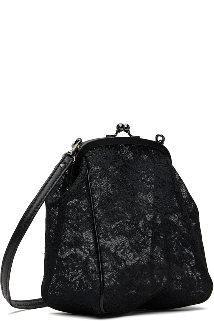 Rigid and sheer embroidered lace shoulder bag.

· Grained leather trim throughout
· Adjustable and detachable crossbody strap
· Kiss-lock closure
· Unlined 
· H7" x W6.5" x D3"

Part of the discord YOHJI YAMAMOTO collection.

Supplier color: Black