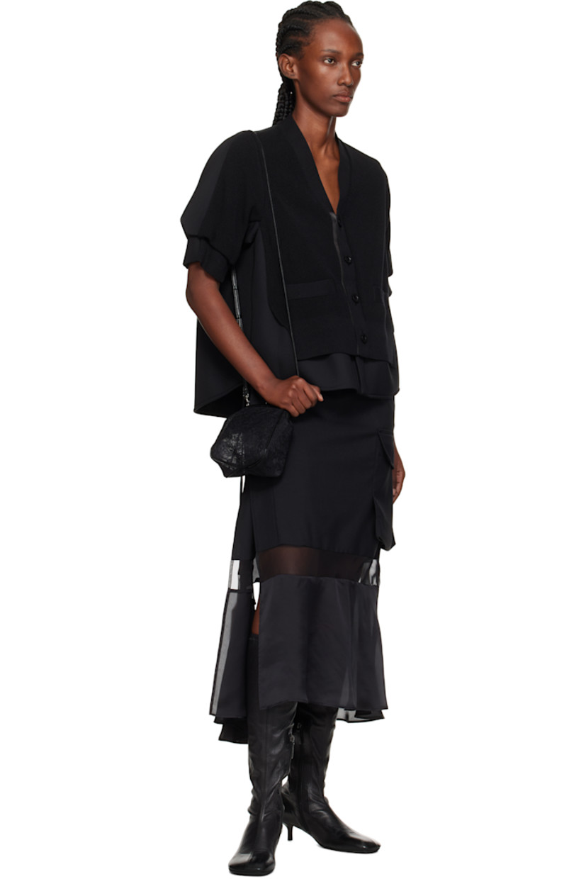Rigid and sheer embroidered lace shoulder bag.

· Grained leather trim throughout
· Adjustable and detachable crossbody strap
· Kiss-lock closure
· Unlined 
· H7" x W6.5" x D3"

Part of the discord YOHJI YAMAMOTO collection.

Supplier color: Black