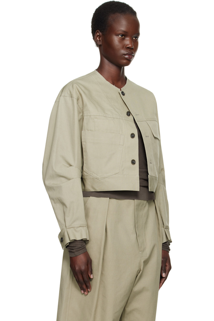 Cotton canvas jacket.

· Subtle distressing at round neck
· Button closure
· Flap pocket and patch pockets at front
· Cropped hem
· Tucks at sleeves and cuffs
· Adjustable single-button barrel cuffs
· Adjustable button tabs at back hem
· Patch pocket at interior
· Unlined

Supplier color: Beige