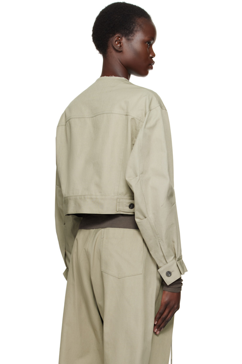 Cotton canvas jacket.

· Subtle distressing at round neck
· Button closure
· Flap pocket and patch pockets at front
· Cropped hem
· Tucks at sleeves and cuffs
· Adjustable single-button barrel cuffs
· Adjustable button tabs at back hem
· Patch pocket at interior
· Unlined

Supplier color: Beige