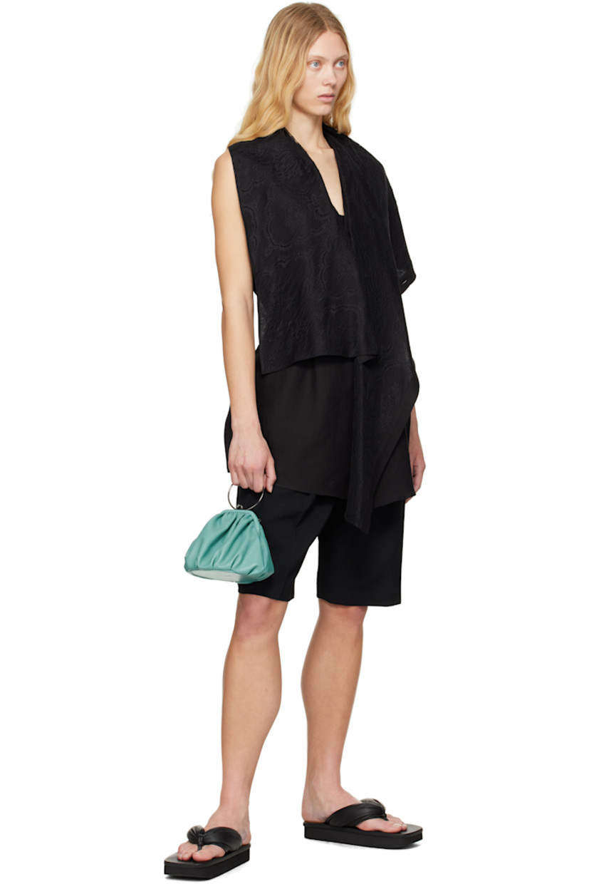 Cotton- and linen-blend broadcloth vest.

· Integrated lace scarf at V-neck
· Button closure 
· Asymmetric hem
· Cinch tabs at back 

Supplier color: Black