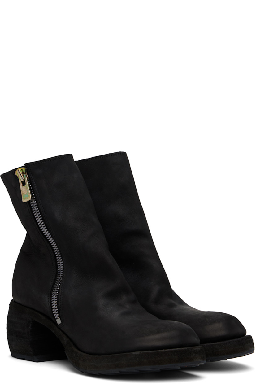 Ankle-high garment-dyed grained leather boots in black.

· Subtle distressing throughout
· Zip closure at outer side
· Stacked leather heel and midsole
· Treaded Vibram® rubber sole
· Heel: H2.25"

Part of the Yohji Yamamoto x Guidi collaboration.

Supplier color: Black