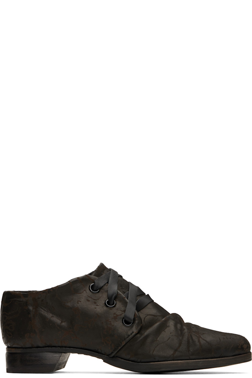 Grained leather derbys in black.

· Laser-printed graphic pattern throughout
· Pointed toe
· Gathering at vamp
· Lace-up closure
· Buffed leather lining
· Leather block heel
· Rubber sole

Supplier color: Black