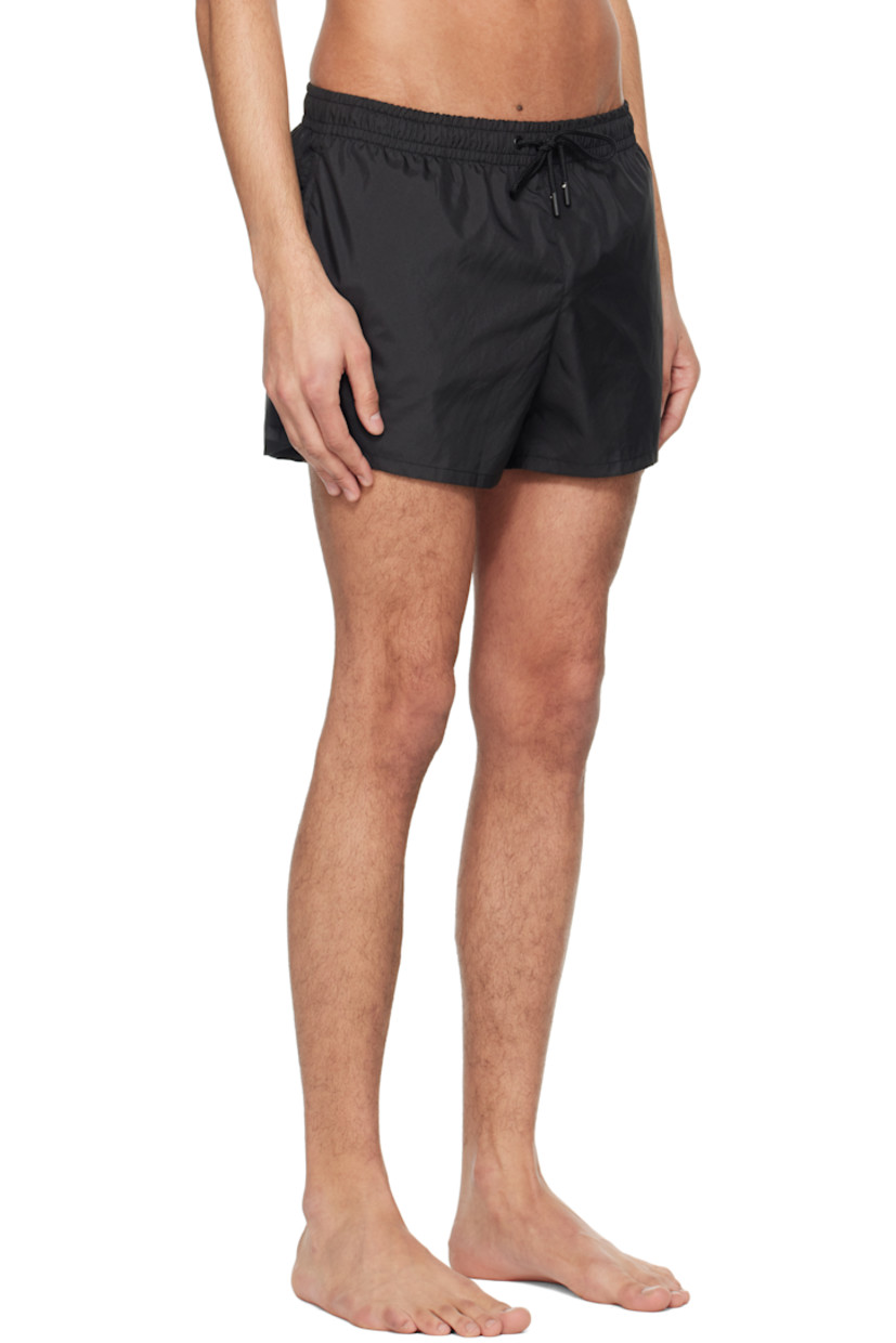 Quick-drying polyester satin swim shorts.

· Drawstring at elasticized waistband
· Two-pocket styling
· Vented cuffs
· Briefs-style mesh lining

Supplier color: Black