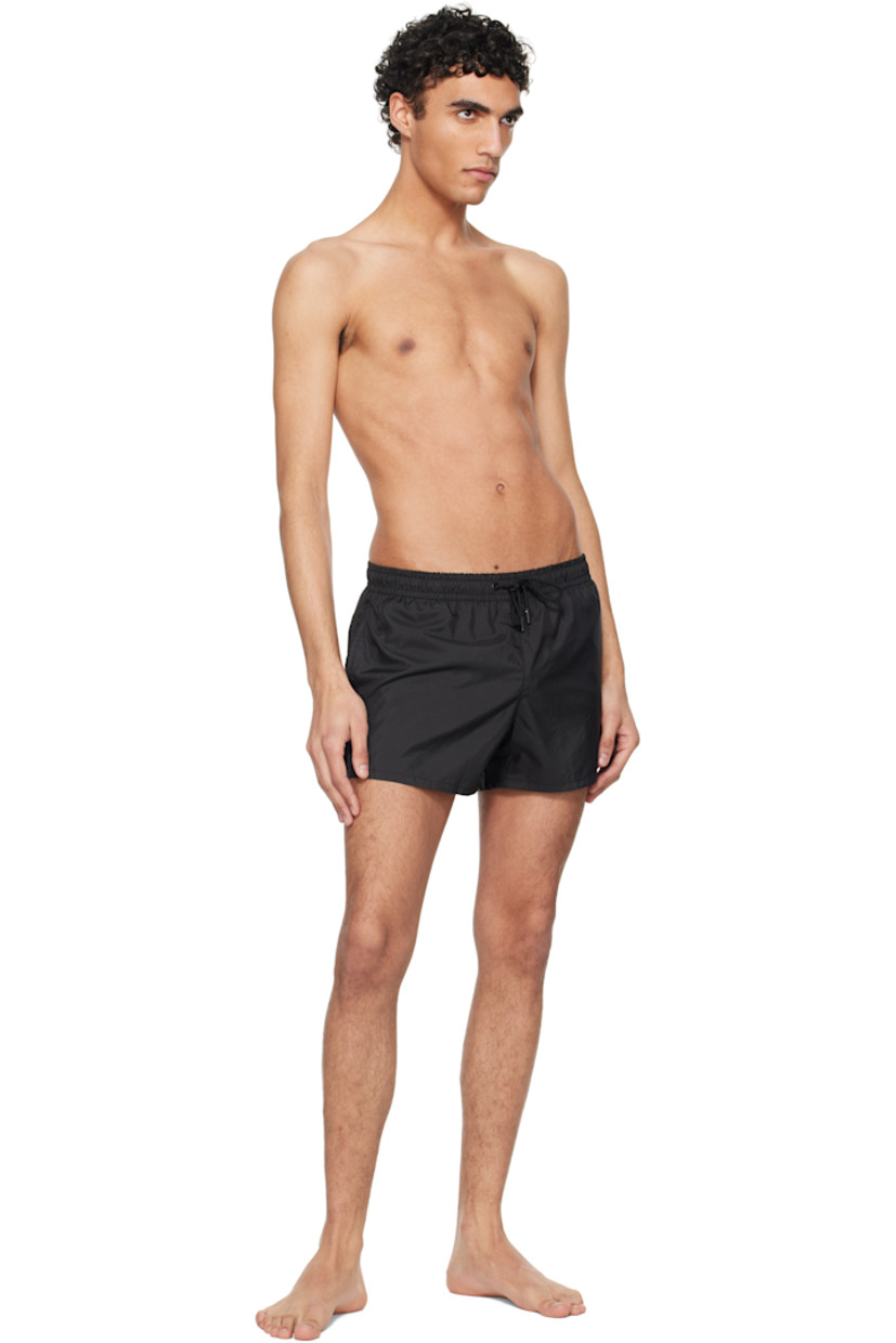 Quick-drying polyester satin swim shorts.

· Drawstring at elasticized waistband
· Two-pocket styling
· Vented cuffs
· Briefs-style mesh lining

Supplier color: Black