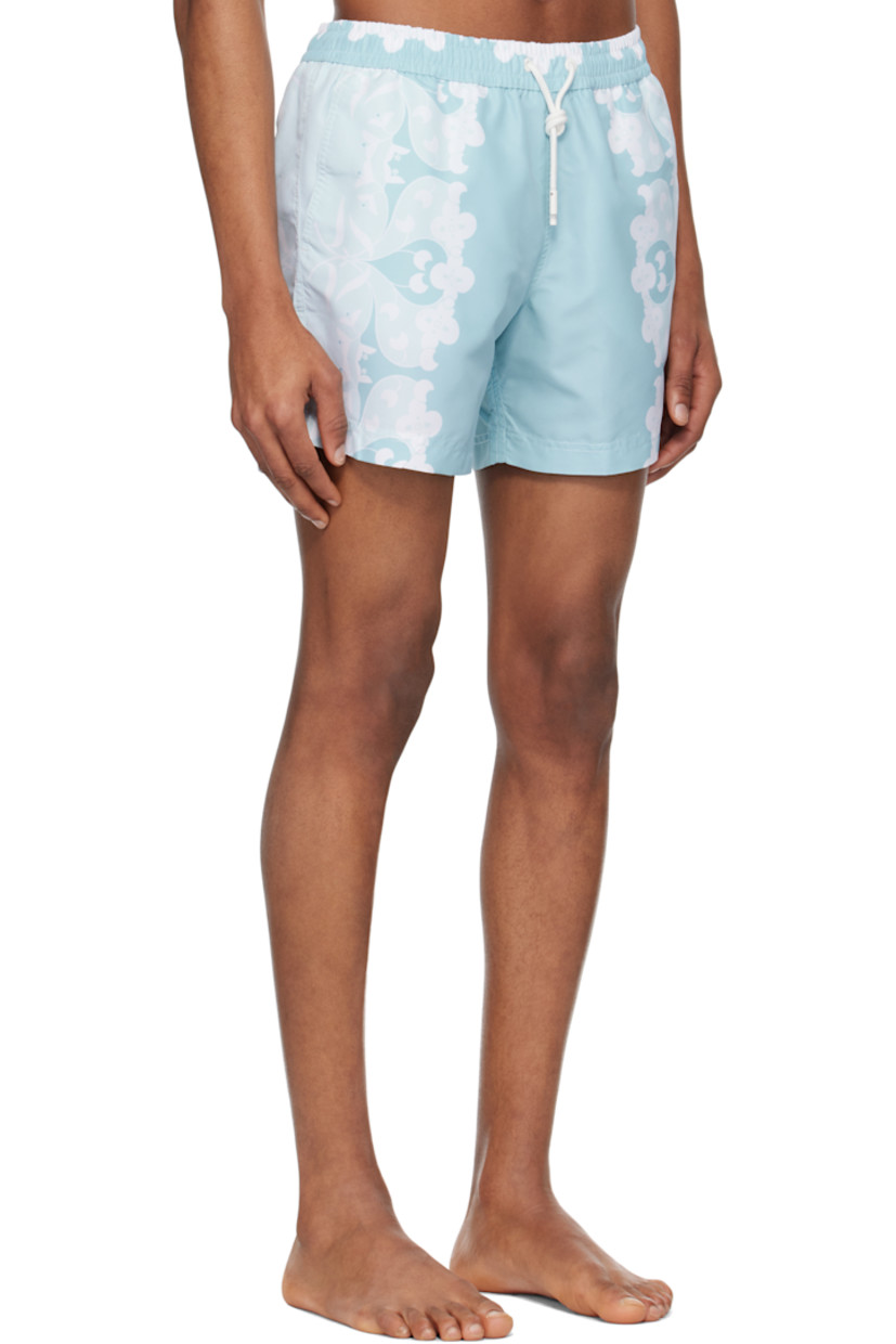 Polyester satin swim shorts. Floral pattern printed throughout.

· Drawstring at elasticized waistband
· Three-pocket styling
· Briefs-style mesh lining

Supplier color: Light blue
