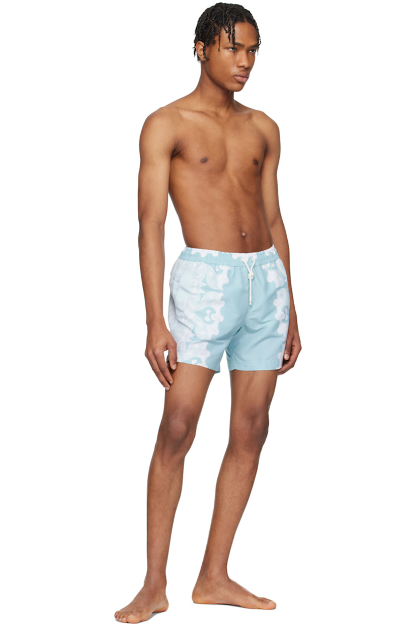 Polyester satin swim shorts. Floral pattern printed throughout.

· Drawstring at elasticized waistband
· Three-pocket styling
· Briefs-style mesh lining

Supplier color: Light blue