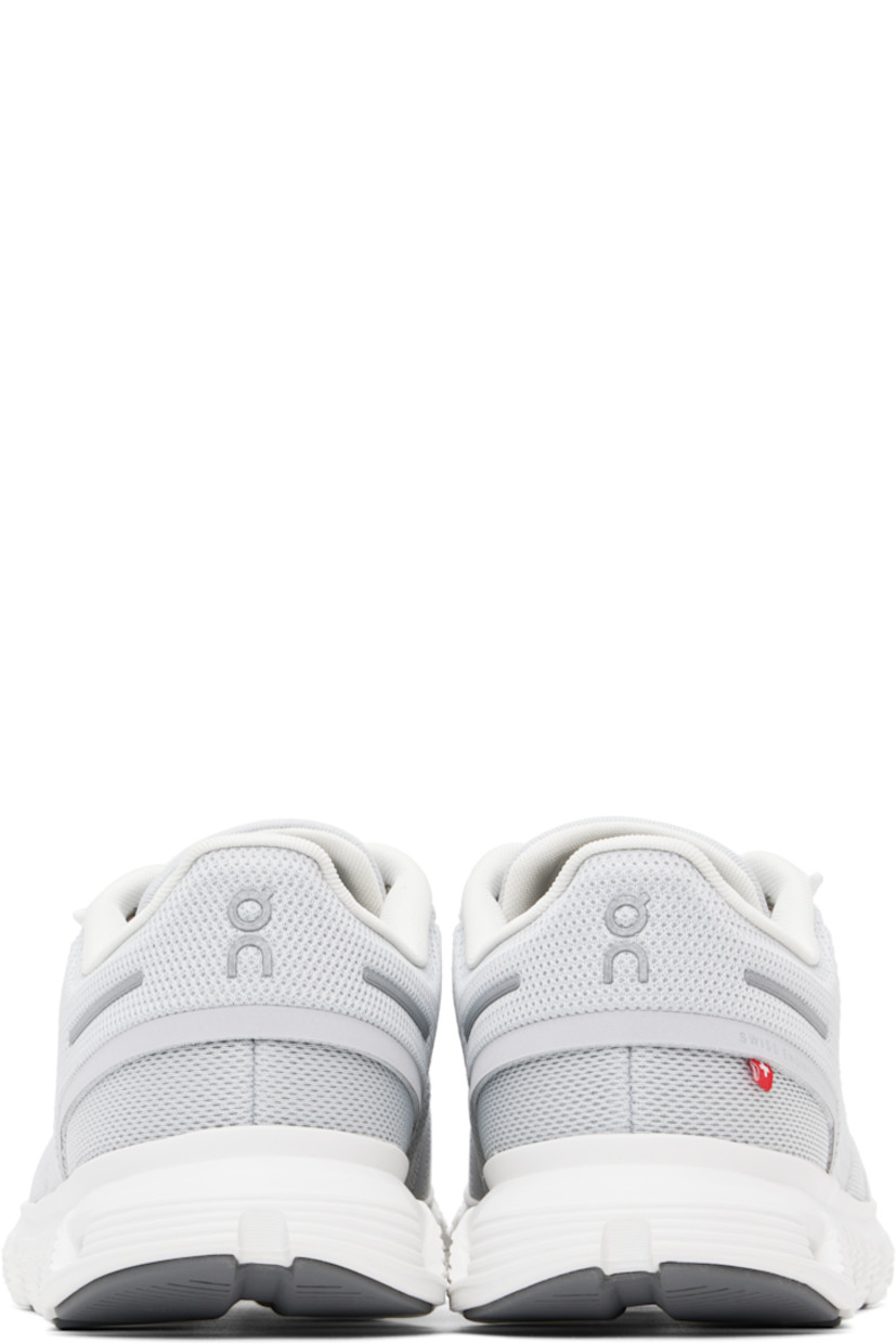 Low-top mesh sneakers in gray.

· Reflective and bonded trim throughout
· Elasticized lace-up closure
· Logo printed at padded tongue 
· Padded collar
· Logo bonded at sides and heel
· Jersey lining
· Zero-Gravity CloudTec® foam rubber midsole
· Speedboard® at treaded rubber sole

Supplier color: Glacier/White
