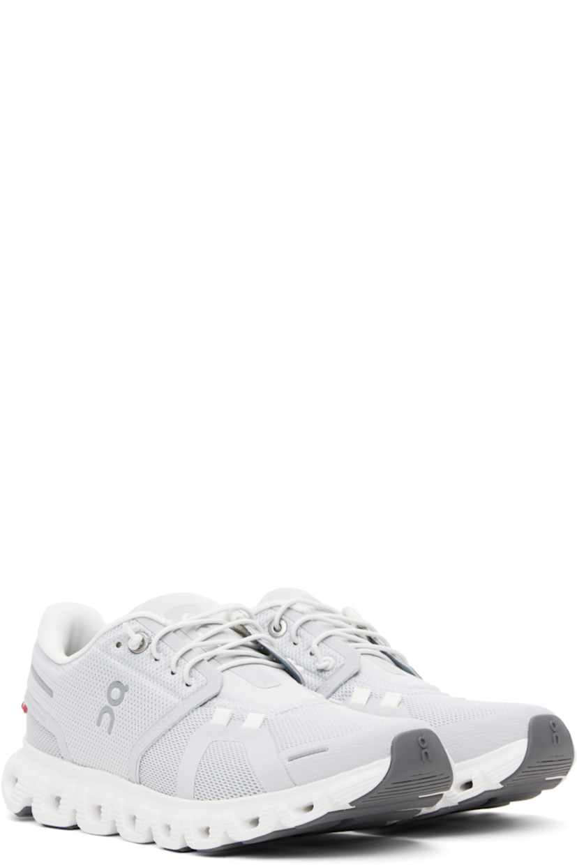 Low-top mesh sneakers in gray.

· Reflective and bonded trim throughout
· Elasticized lace-up closure
· Logo printed at padded tongue 
· Padded collar
· Logo bonded at sides and heel
· Jersey lining
· Zero-Gravity CloudTec® foam rubber midsole
· Speedboard® at treaded rubber sole

Supplier color: Glacier/White