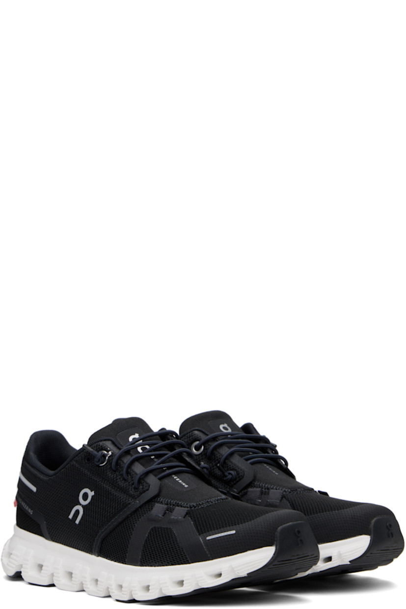 Low-top mesh sneakers in black.

· Reflective and bonded trim throughout
· Elasticized lace-up closure
· Logo printed at padded tongue 
· Padded collar
· Logo bonded at sides and heel
· Jersey lining
· Zero-Gravity CloudTec® foam rubber midsole
· Speedboard® at treaded rubber sole

Supplier color: Black/White