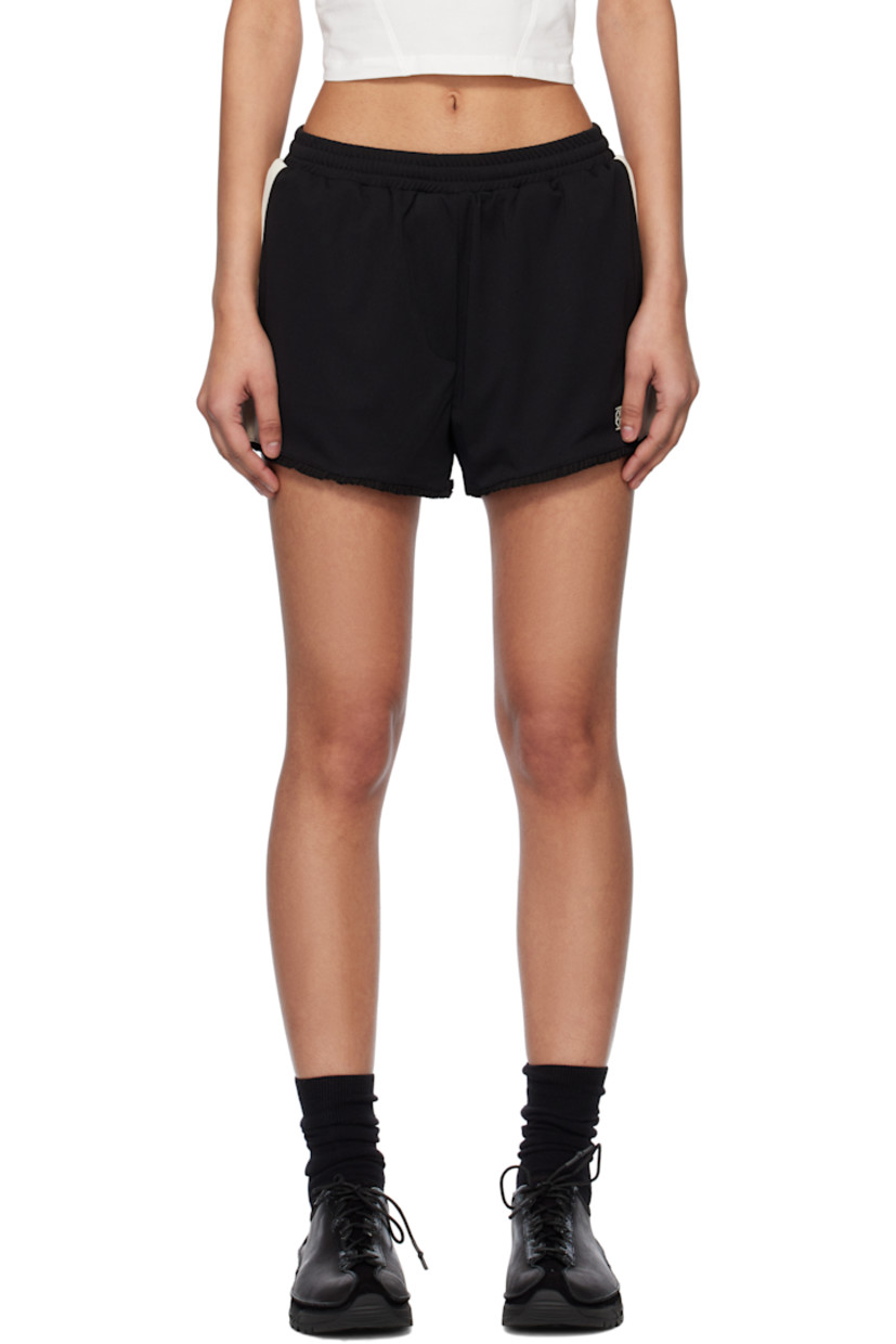 Polyester jersey shorts. 

· Mid-rise
· Concealed elasticized waistband
· Two-pocket styling
· Mock fly
· Logo embroidered at front
· Ruffled trim at cuffs
· Mesh trim at outseams and back 
· Full mesh lining

Supplier color: Black/Ivory