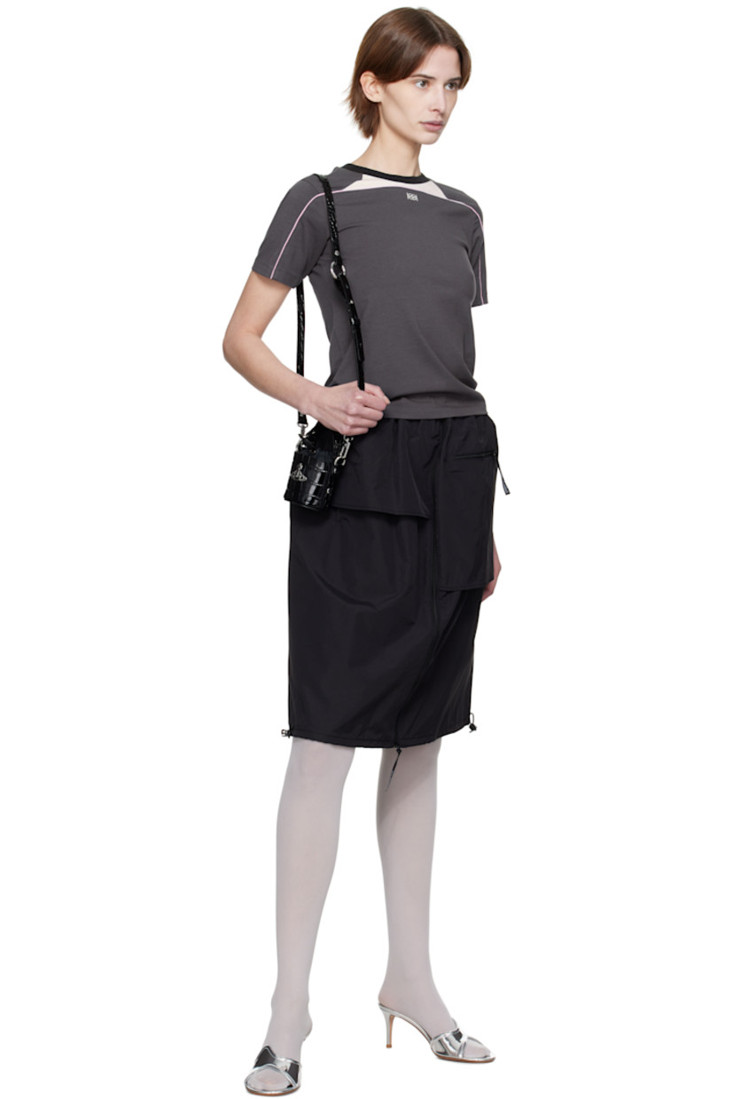 Nylon taffeta midi skirt.

· Layered and asymmetrical construction
· Elasticized waistband
· Four-pocket styling
· Zip closure at front
· Bungee-style drawstring at hem
· Full taffeta lining

Supplier color: Black