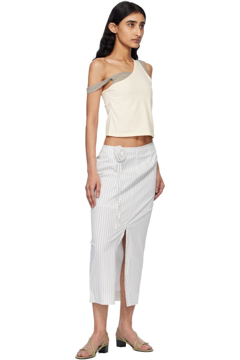 Stretch cotton-blend poplin maxi skirt. Stripes and embroidered detailing throughout. 

· Floral appliqué and extended trim at front
· Slit at hem
· Concealed zip closure at back
· Partial sateen lining

Supplier color: Off-white stripe