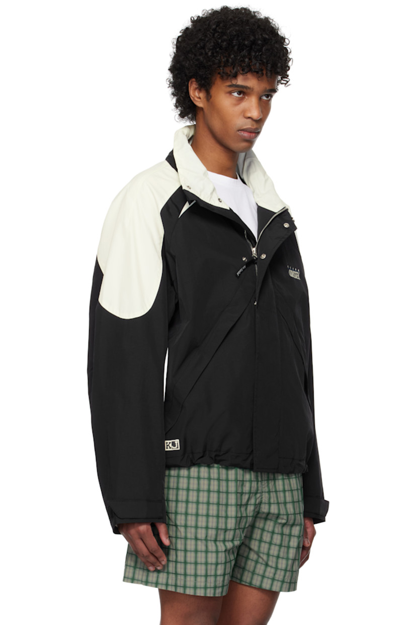 Nylon taffeta jacket.

· Paneled construction
· Stand collar
· Zip closure
· Press-stud placket
· Logo and text embroidered at chest
· Zip pockets
· Concealed bungee-style drawstring at hem
· Logo patch at side seam
· Raglan sleeves
· Velcro tab at cuffs
· Rubberized logo patch at back collar
· Welt pocket at interior
· Mesh lining

Supplier color: Black/Ivory