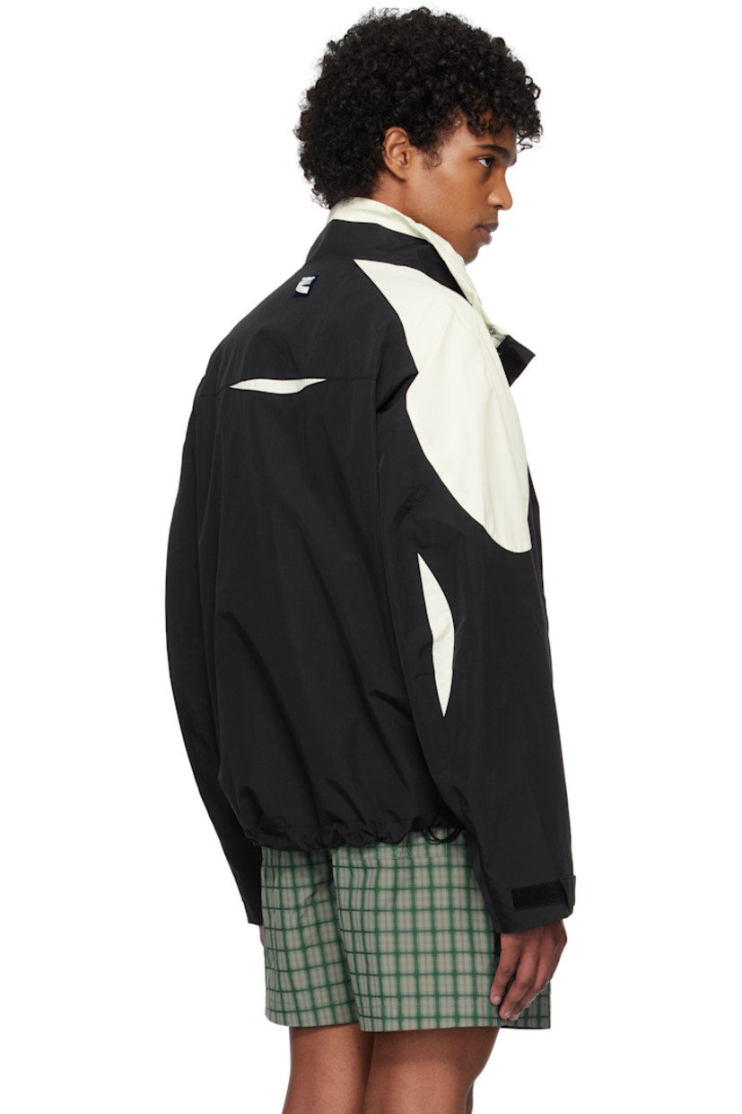 Nylon taffeta jacket.

· Paneled construction
· Stand collar
· Zip closure
· Press-stud placket
· Logo and text embroidered at chest
· Zip pockets
· Concealed bungee-style drawstring at hem
· Logo patch at side seam
· Raglan sleeves
· Velcro tab at cuffs
· Rubberized logo patch at back collar
· Welt pocket at interior
· Mesh lining

Supplier color: Black/Ivory