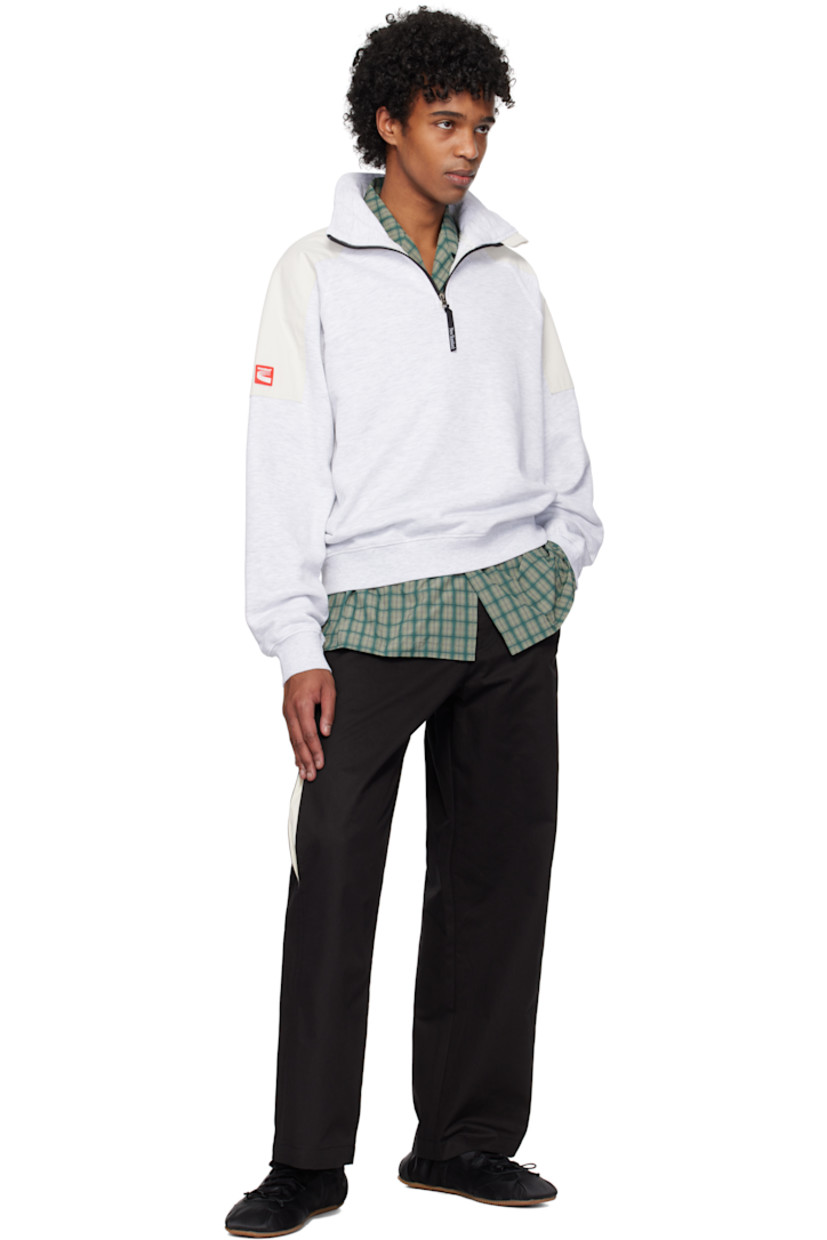 Cotton twill trousers.

· Belt loops
· Four-pocket styling
· Zip fly
· Rivet at fly
· Slit at legs
· Logo patch at back pocket

Supplier color: Black/Cream