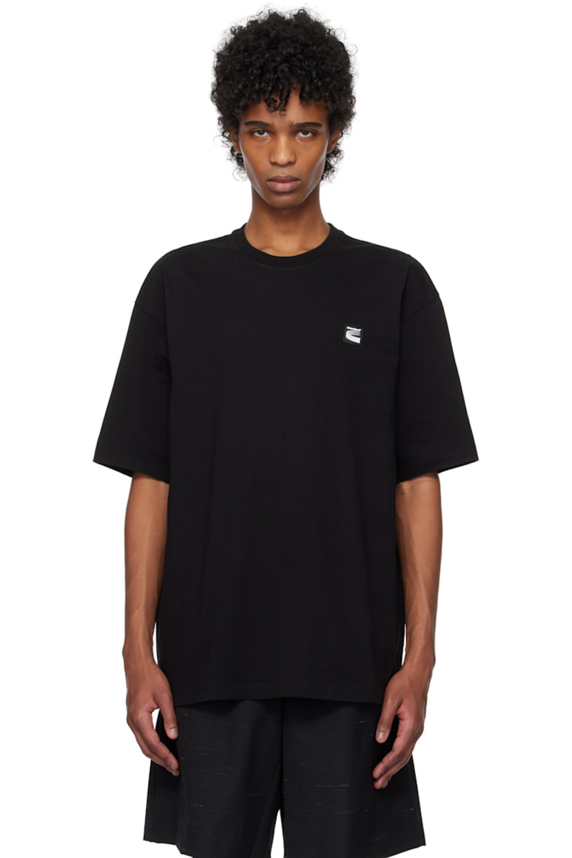 Oversized cotton jersey T-shirt.

· Rib-knit crewneck
· Rubberized logo patch at chest
· Dropped shoulders
· Text and graphic printed at back
· Logo embroidered at back collar

Supplier color: Black