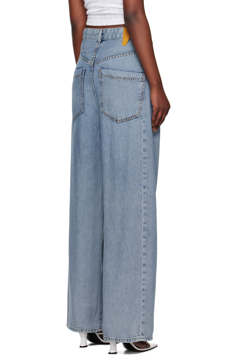 Stretch denim jeans. Fading throughout.

· Belt loops
· Offset hook-eye fastening at waistband
· Five-pocket styling
· Zip-fly
· Dropped inseam
· Leather logo patch at back waistband
· Logo-engraved gold-tone hardware
· Contrast stitching in tan

Supplier color: San fran blue