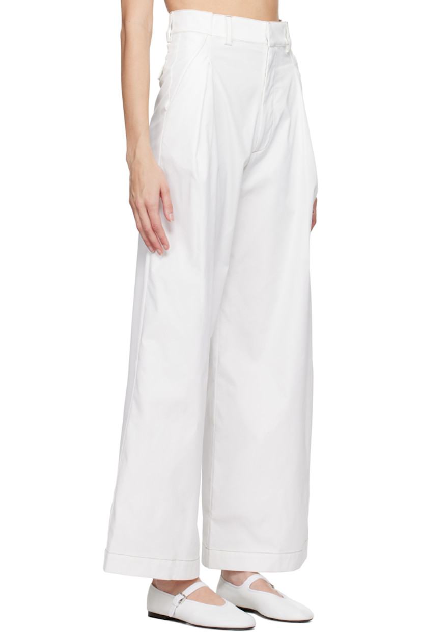 Wide-leg polyester twill trousers. 

· Belt loops
· Four-pocket styling
· Zip-fly
· Pleats at front

Supplier color: White