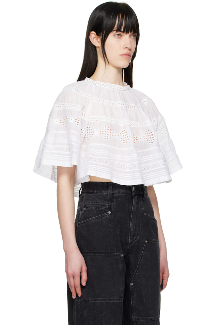 Cotton poplin blouse. Lace trim, gathering, and embroidered detailing throughout.

· Button fastening at crewneck
· Raglan sleeves

Supplier color: White