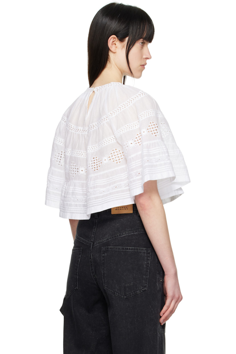 Cotton poplin blouse. Lace trim, gathering, and embroidered detailing throughout.

· Button fastening at crewneck
· Raglan sleeves

Supplier color: White
