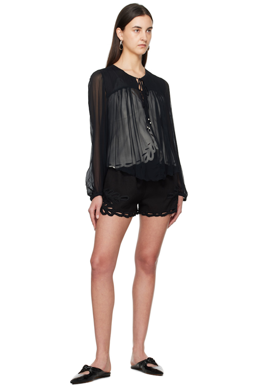 Lightweight semi-sheer viscose gauze blouse. Gathering throughout.

· Round neck
· Self-tie fastening at chest
· Raw edge at curved hem
· Elasticized cuffs

Supplier color: Faded black