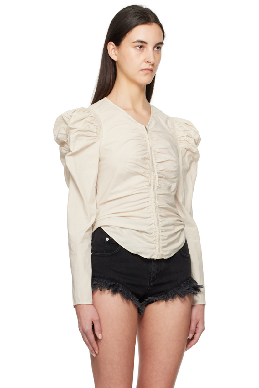 Organic cotton poplin blouse. Ruching throughout.

· V-neck
· Zip closure
· Shirttail hem
· Gigot sleeves

Supplier color: Ecru