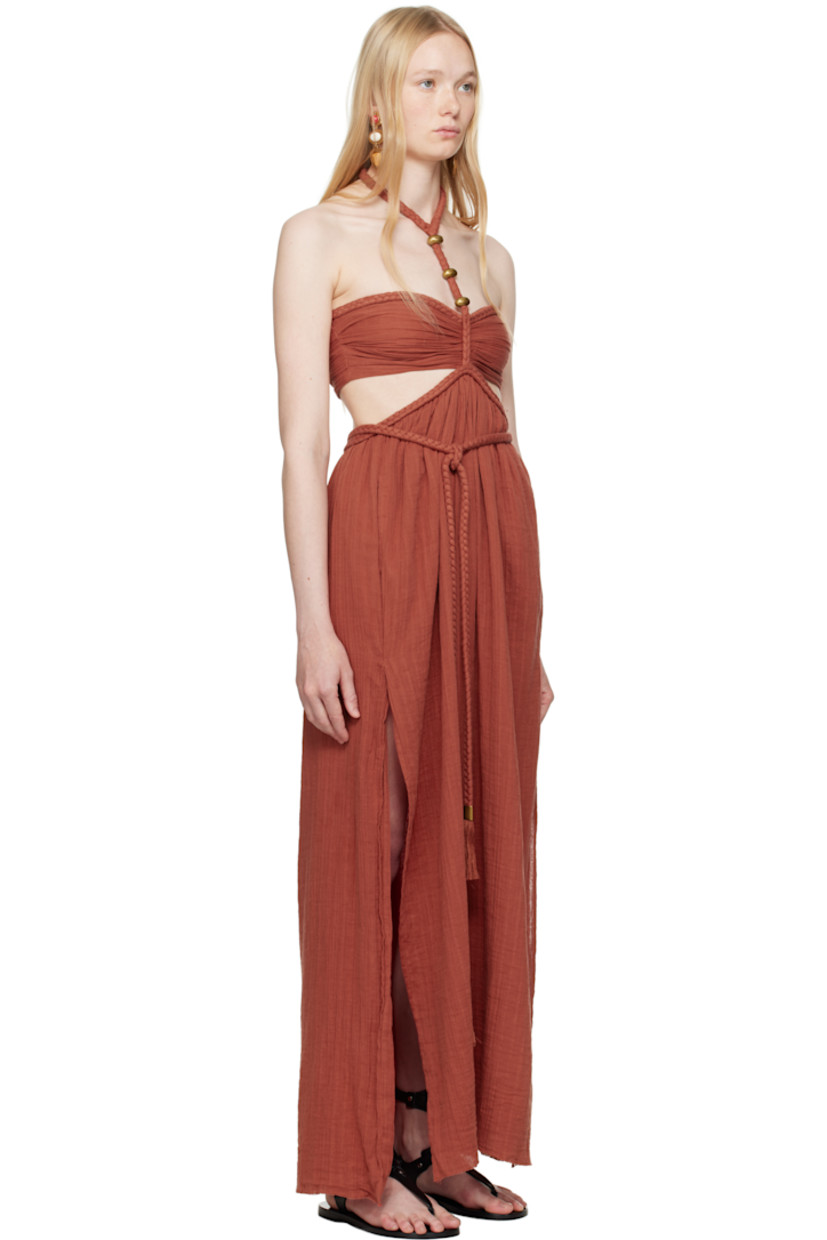 Organic cotton gauze maxi dress. Braided trim throughout.

· Adjustable button fastening at halter neck
· Hardware at chest
· Integrated self-tie cord belt at waist
· Cutout at side seams and back
· Seam pockets at waist
· Slit at side seams
· Zip closure at back
· Full silk crêpe lining
· Gold-tone hardware

Supplier color: Burnt orange