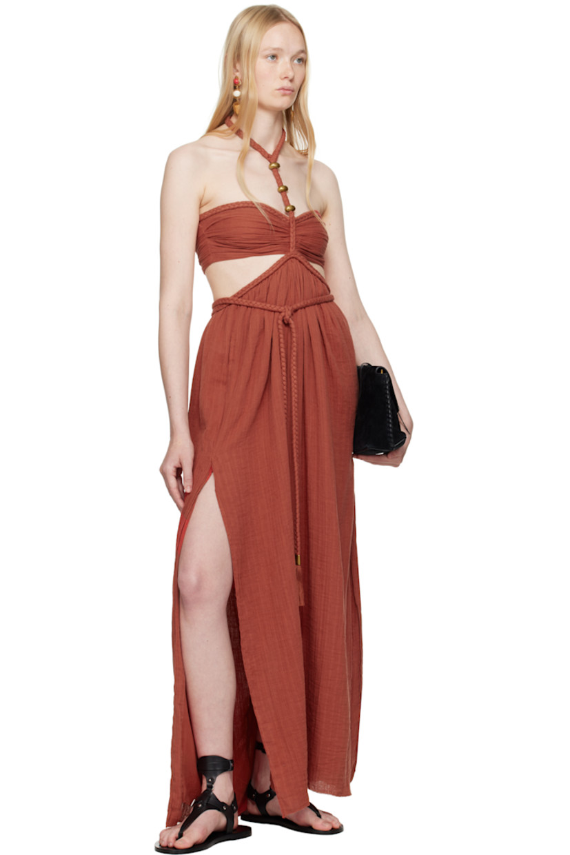 Organic cotton gauze maxi dress. Braided trim throughout.

· Adjustable button fastening at halter neck
· Hardware at chest
· Integrated self-tie cord belt at waist
· Cutout at side seams and back
· Seam pockets at waist
· Slit at side seams
· Zip closure at back
· Full silk crêpe lining
· Gold-tone hardware

Supplier color: Burnt orange