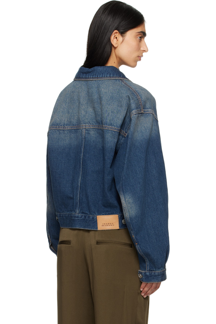 Non-stretch denim jacket. Fading throughout. 

· Spread collar
· Button closure
· Welt pockets
· Dropped shoulders
· Single-button barrel cuffs
· Adjustable button tabs and leather logo patch at back hem
· Logo-engraved silver-tone hardware
· Contrast stitching in tan

Supplier color: Faded blue