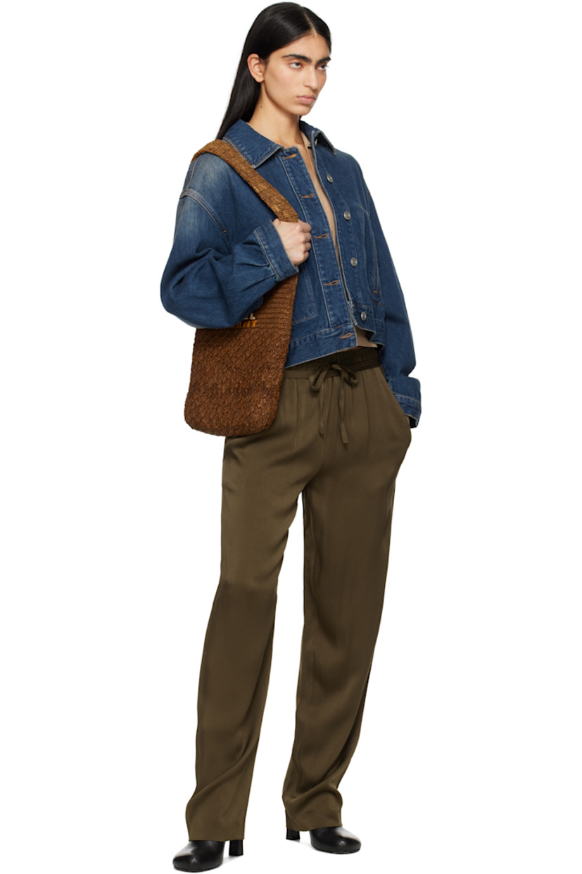 Non-stretch denim jacket. Fading throughout. 

· Spread collar
· Button closure
· Welt pockets
· Dropped shoulders
· Single-button barrel cuffs
· Adjustable button tabs and leather logo patch at back hem
· Logo-engraved silver-tone hardware
· Contrast stitching in tan

Supplier color: Faded blue