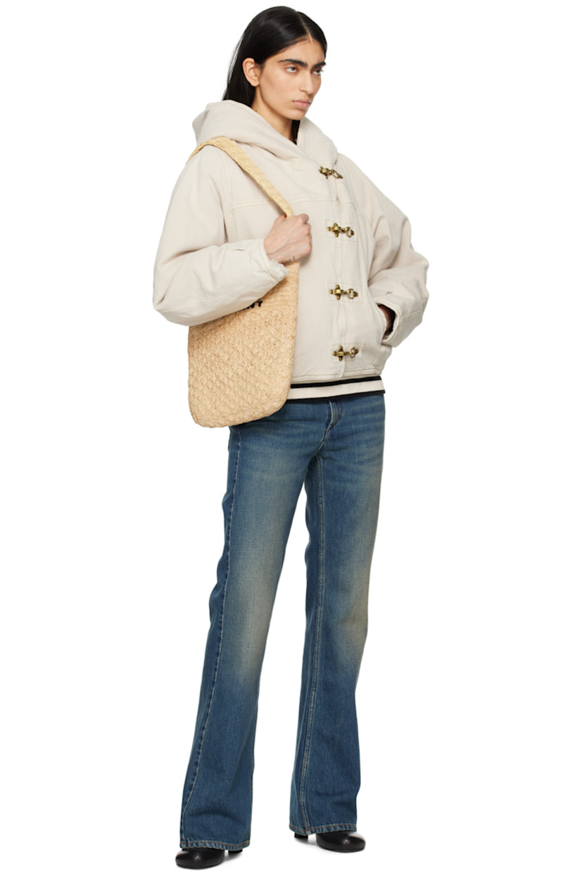 Non-stretch organic cotton- and hemp-blend denim jacket. 

· Lanyard-clasp closure
· Welt pockets
· Tucks at hem and cuffs
· Full faux-shearling lining
· Gold-tone hardware

Supplier color: Ecru