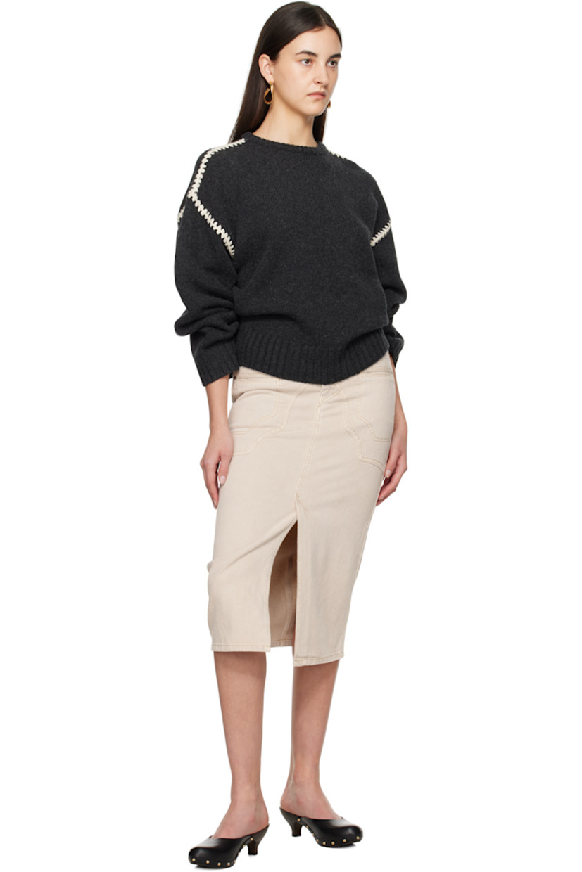 Non-stretch cotton- and hemp-blend denim midi skirt.

· Paneled construction
· Belt loops
· Six-pocket styling
· Zip-fly
· Central vent at front hem
· Leather logo patch at back waistband
· Logo-engraved bronze-tone hardware

Supplier color: Ecru