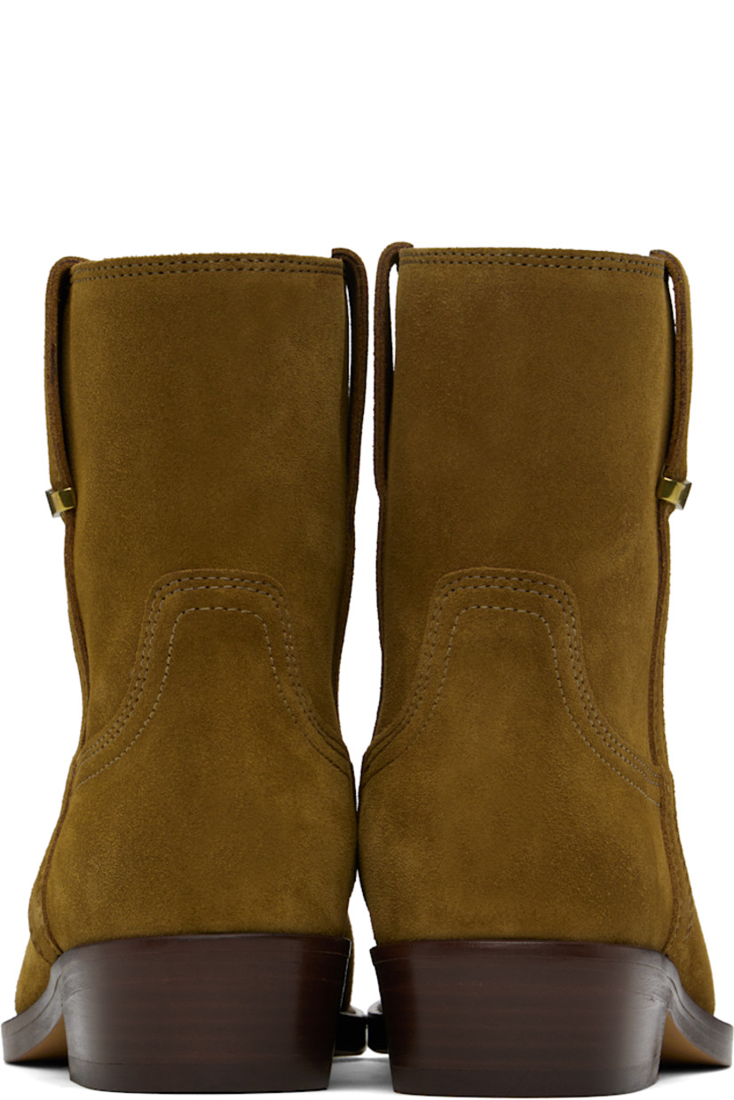 Ankle-high suede calfskin boots in brown.

· Logo-engraved hardware at outer side
· Topstitching at welt
· Nubuck calfskin lining
· Stacked leather heel with rubber injection
· Leather sole
· Heel: H1.25"

Supplier color: Sepia
