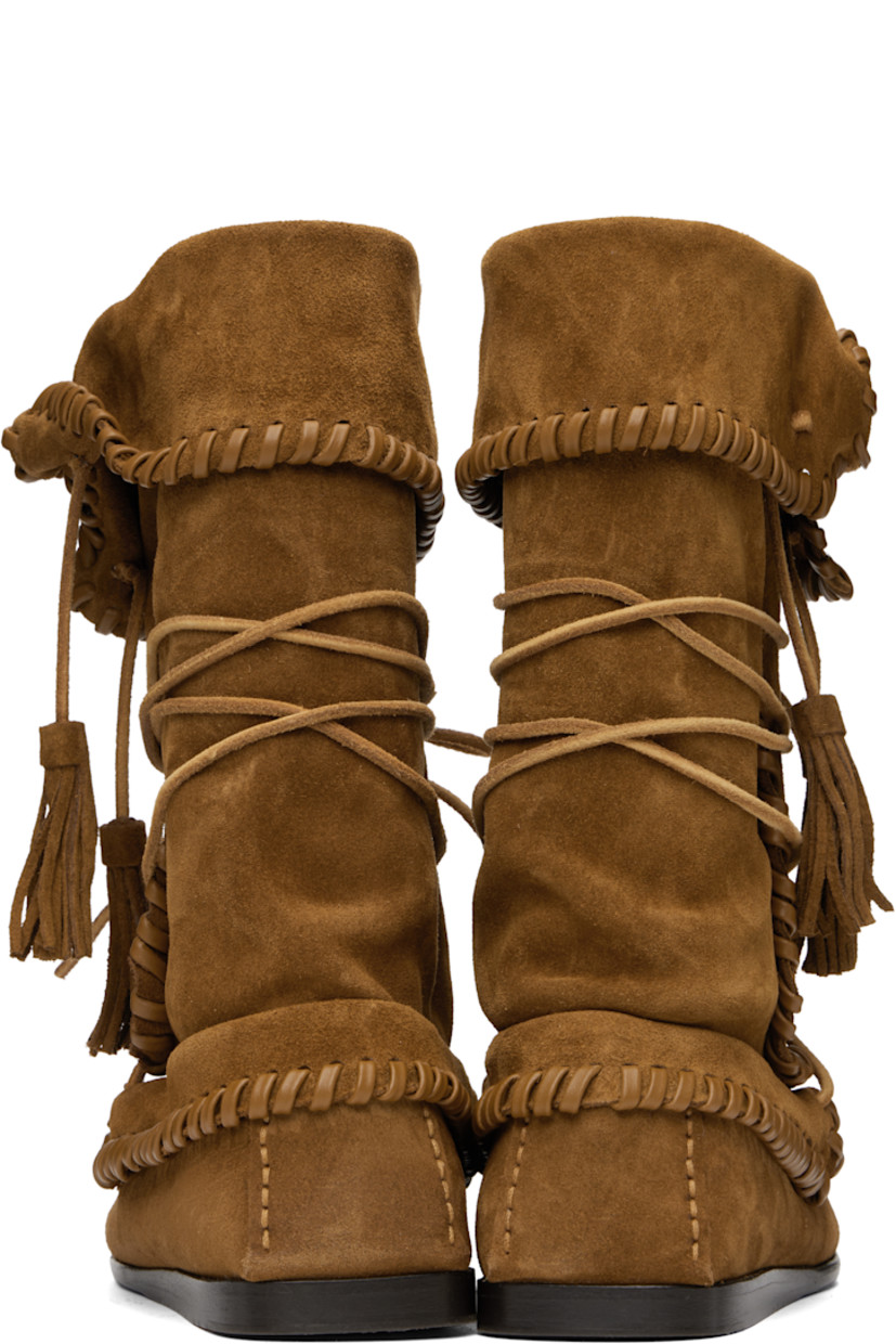 Mid-calf suede slip-on boots in brown.

· Braided leather trim throughout
· Moc toe
· Woven leather detailing at vamp
· Wraparound lace-up closure
· Tassels at foldover collar
· Smooth leather sole with rubber injection

Supplier color: Cognac