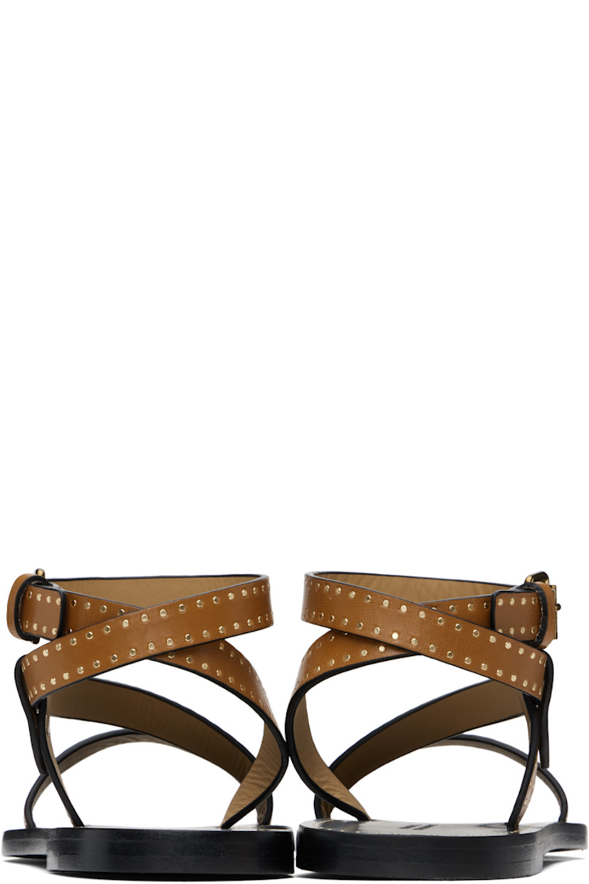 Buffed leather flat sandals in brown.

· Studded detailing throughout
· Open toe
· Strap at vamp
· Wraparound pin-buckle ankle strap
· Logo embossed at footbed
· Polished leather sole with rubber injection
· Logo-engraved antiqued brass-tone hardware

Supplier color: Havana