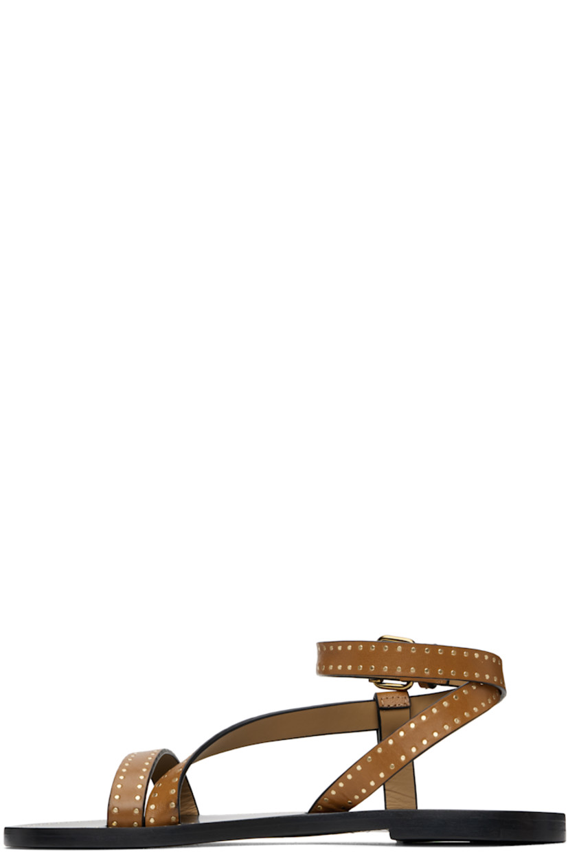 Buffed leather flat sandals in brown.

· Studded detailing throughout
· Open toe
· Strap at vamp
· Wraparound pin-buckle ankle strap
· Logo embossed at footbed
· Polished leather sole with rubber injection
· Logo-engraved antiqued brass-tone hardware

Supplier color: Havana
