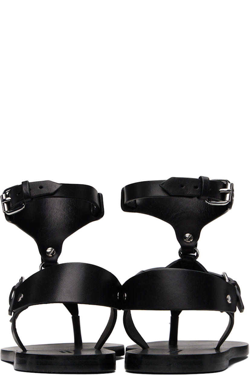 Buffed leather flat sandals in black.

· Rivets throughout
· Thong-style strap at open toe
· Pin-buckle vamp and ankle strap
· Logo embossed at footbed
· Polished leather sole with rubber injection
· Silver-tone hardware

Supplier color: Black