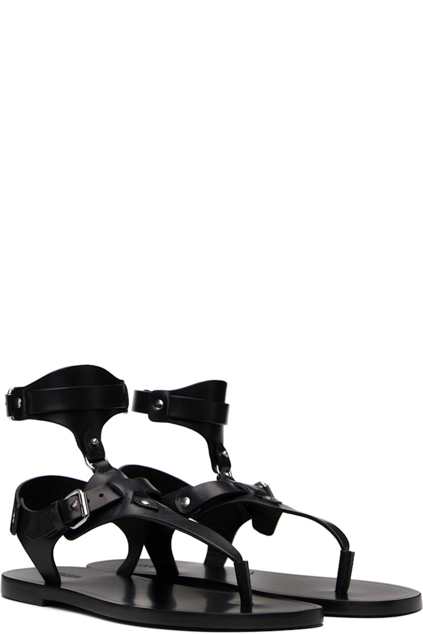 Buffed leather flat sandals in black.

· Rivets throughout
· Thong-style strap at open toe
· Pin-buckle vamp and ankle strap
· Logo embossed at footbed
· Polished leather sole with rubber injection
· Silver-tone hardware

Supplier color: Black