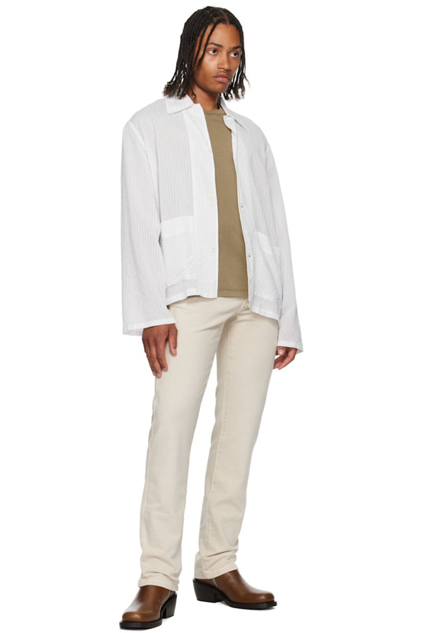 Non-stretch denim jeans.

· Belt loops
· Five-pocket styling
· Zip-fly
· Leather logo patch at back
· Logo-engraved silver-tone hardware
· Contrast stitching in tan

Supplier color: Off-white