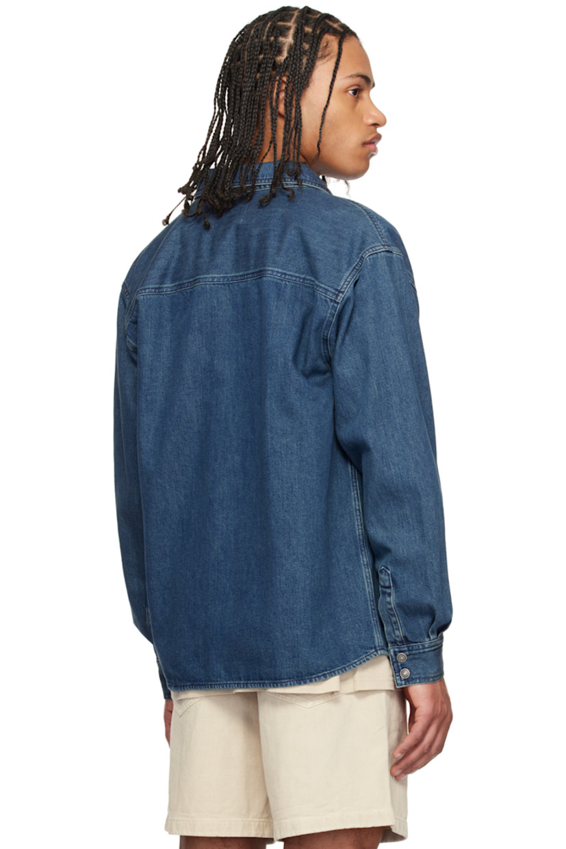 Non-stretch denim shirt. Fading throughout. 

· Paneled construction
· Spread collar
· Press-stud closure
· Patch pockets with rivets
· Shirttail hem
· Buttoned barrel cuffs
· Silver-tone logo-engraved hardware

Supplier color: Blue