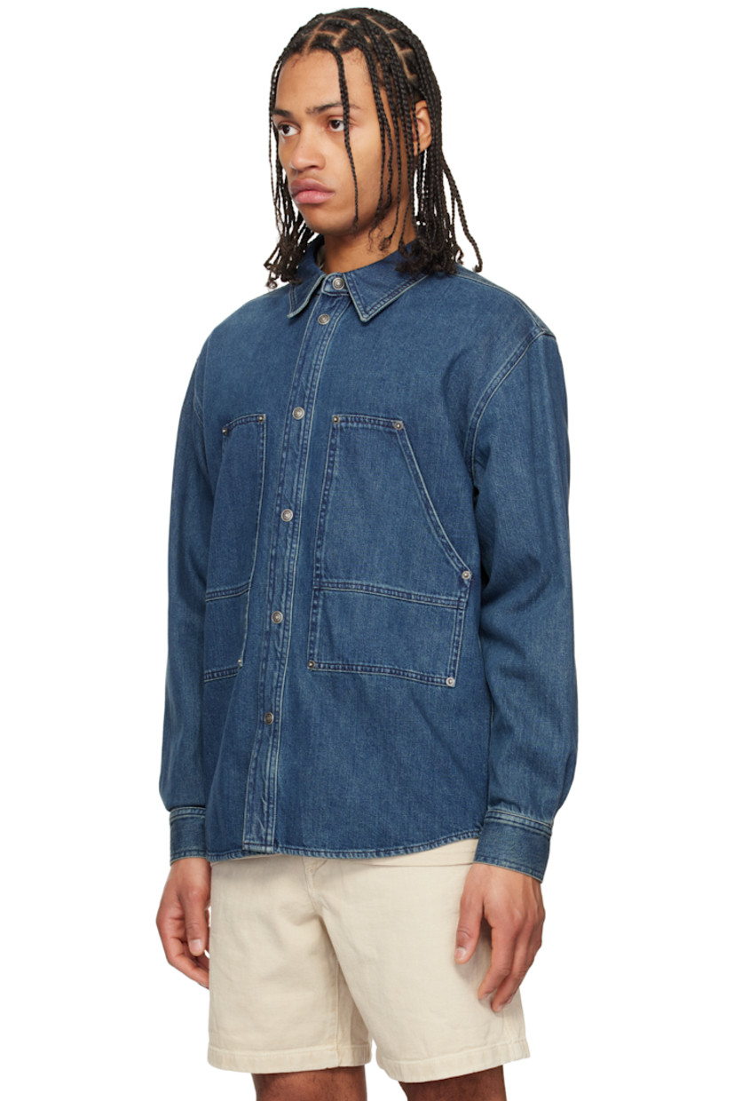 Non-stretch denim shirt. Fading throughout. 

· Paneled construction
· Spread collar
· Press-stud closure
· Patch pockets with rivets
· Shirttail hem
· Buttoned barrel cuffs
· Silver-tone logo-engraved hardware

Supplier color: Blue