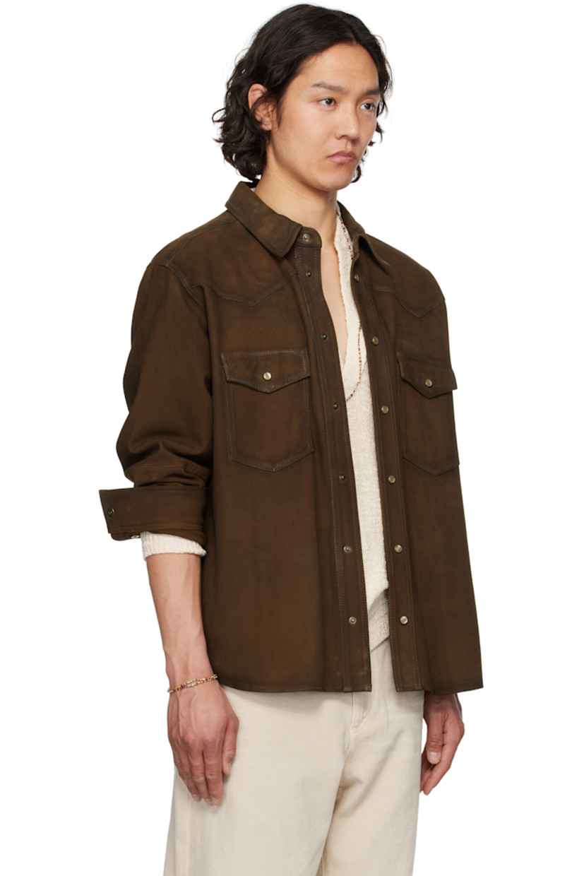 Goatskin suede shirt. Fading throughout. 

· Spread collar
· Press-stud closure
· Patch pockets
· Shirttail hem
· Buttoned barrel cuffs

Supplier color: Brown