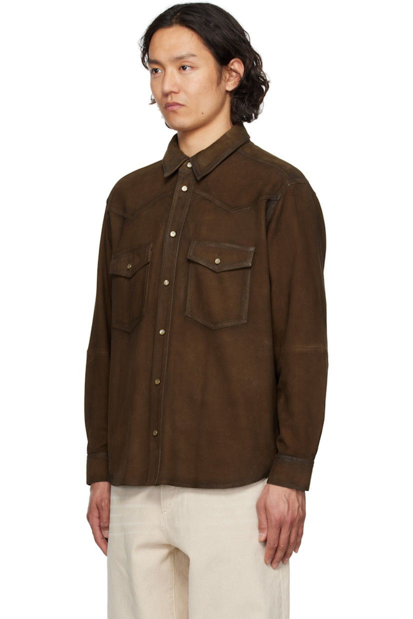 Goatskin suede shirt. Fading throughout. 

· Spread collar
· Press-stud closure
· Patch pockets
· Shirttail hem
· Buttoned barrel cuffs

Supplier color: Brown